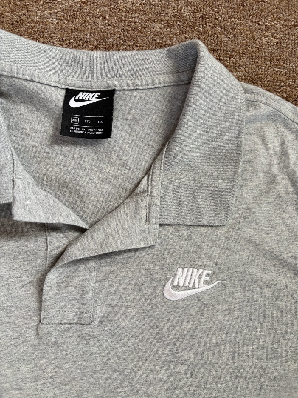 Nike Menโs Light Grey Polo Shirt with White Embroidered Swoosh